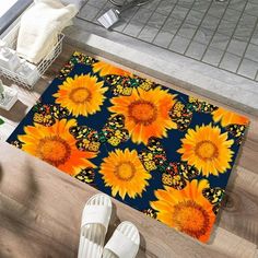 sunflowers on blue and yellow area rug with white slippers next to potted plant