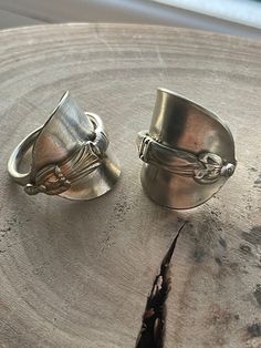 2 available.  Recycled apostle coffee spoon ring. Made from ESPN silver.  Hand hammered and formed with the bowl and stem wrapped around each other. Each one unique with lovely detail. 2 available.  Ring 1 Size UK W 2.5cm height 3cm across Ring band 5mm Ring 2 UK size U 3cm height 3.5 cm across 5mm ring band. Each ring has a brushed finish with the silver appearing an off silver/ light brass colour. Each spoon has natural patina and wear and dents and dings.  Large rings that would look amazing on the thumb. Ring From Spoon, Etsy Wishlist, Large Rings, Silver Spoon Ring, Silver Gift Wrap, Spoon Ring, Spoon Rings, Silver Lights, Silver Spoons