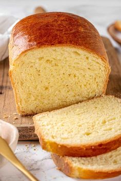 a loaf of bread sitting on top of a cutting board