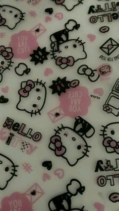 a bunch of hello kitty stickers on a white sheet with pink and black designs