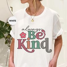 Promote kindness with our Bella Canvas t-shirt featuring the heartwarming "Always Be Kind" design.  This soft, stylish tee showcases colorful, distressed typography with a floral accent, making it perfect for anyone who believes in spreading kindness and positivity. Whether you're seeking a thoughtful gift or a new favorite tee, this shirt combines comfort and an inspiring message. 🛍️HOW TO ORDER: 1️⃣To begin, select the desired product type and size from the drop-down menu. 2️⃣Next, choose the Inspirational White Pre-shrunk T-shirt, Inspirational White T-shirt With Letter Print, Inspirational Letter Print White T-shirt, Inspirational White Graphic Print T-shirt, Distressed Typography, Spreading Kindness, Inspiring Message, Spread Kindness, Inspirational Message