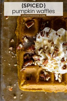 pumpkin waffles topped with whipped cream and pecans