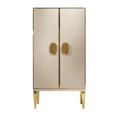 a white and gold cabinet with two doors on each side, one door open to reveal the