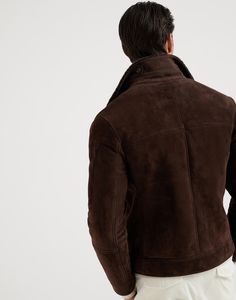 Suede shearling one-and-a-half breasted outerwear jacket The excellence of Brunello Cucinelli materials enhances the retro feel of this jacket with the iconic one-and-a-half-breasted closure. The suede shearling combines a smooth, velvety hand with a warm, plush interior, making it perfect to face the cold. The silhouette follows the classic codes of menswear with wide lapels on the collar. Classic Shearling Outerwear With Pockets, Luxury Winter Leather Jacket With Double Button Closure, Fitted Shearling Outerwear With Padded Collar, Luxury Brown Outerwear With Double Button Closure, Classic Shearling Long Sleeve Outerwear, Luxury Shearling Outerwear With Pockets, Fitted Shearling Outerwear For Work, Classic Long Sleeve Fur Coat With Padded Collar, Luxury Long Sleeve Shearling Outerwear