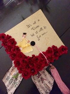 a graduation cap decorated with flowers and writing