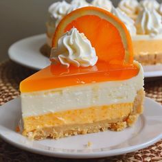 there is a slice of orange cheesecake on the plate