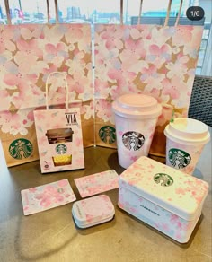 starbucks coffee cups, coasters and other items on a table