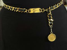 Classic and chic, this vintage Chanel chain leather belt is crafted in gold-plated metal, accented with a 'CC' logo-engraved medallion pendant. Closure can be hooked on multiple links for a variety of fits.Brooch Specifications:Designer: CHANELFits Waist Size Up To: 33"Coin Measurements: ~1.25" Stamped: "CHANEL "Made in France"Condition: PreownedGold Plated Chanel 19 Belt Phone Holder, Luxury Elegant Chain Belt With Gold-tone Hardware, Designer Luxury Jewelry With Chain Strap, Luxury Yellow Gold Metal Chain Belt, Luxury Metal Chain Belt, Luxury Chain Belt With Gold-tone Hardware, Luxury Adjustable Chain Link Belt, Luxury Gold Chain Link Belt, Gold Waist Chain Chanel