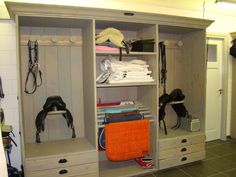 an open closet with several different items in it