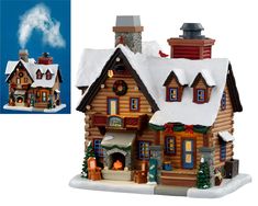 a small wooden house with snow on the roof and chimneys covered in christmas decorations