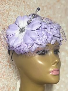 Lavender Flower Fascinator Half Hat for Weddings, Church, Tea Parties, and Other Special Occasions  Accented with veil, bows, hat pin, and rhinestones. The hat pin may vary and is for decorative purposes only. The hat is affixed to the head via a hatstring. Available in 2 sizes: 8 X 5.5 inches  10 X 7 inches The mannequin is wearing the 8 by 5.5 inches. Handmade Gifts for mom, sister, wife, or yourself. SHIPPING  All items for free shipping will be shipped via USPS FIRST CLASS MAIL. Lavender Fascinator Hat, Elegant Purple Fascinator For Church, Flower Decoration Fascinator For Weddings, Formal Purple Headband Headpiece, Purple Fascinator With Handmade Flowers For Parties, Purple Party Fascinator With Handmade Flowers, Adjustable Lavender Fascinator For Evening, Purple Handmade Flowers Fascinator For Party, Lavender Fascinator For Kentucky Derby