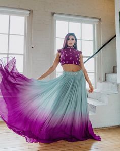 Plumeria's statement blouse is paired with a flowy, grey to purple ombre lehenga. Plumeria is a statement look for any South Asian event! DELIVERY TIMEPlease allow 1 week for your order to be dispatched. FABRIC DETAILSRaw silk, georgette. Professional cleaning only. Ombre Chaniya Choli, Skirt Design For Lehenga, Best Colour Combination For Lehanga, Ombre Outfits Indian, Ombre Lehenga Indian Weddings, Ombre Dress Designs, Lavender Georgette Lehenga For Party, Ombre Dress Indian, Ombre Outfits