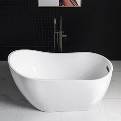 a white bath tub sitting on top of a bathroom floor