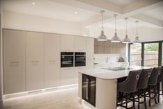 a kitchen with an island and bar stools