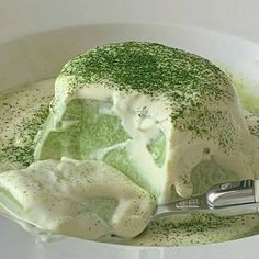 a bowl filled with green and white food