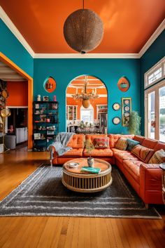 a living room with orange and blue walls