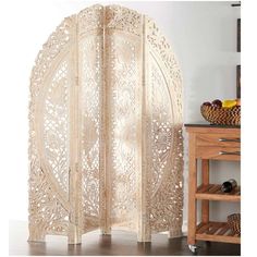 a room divider made out of wood with an intricate design on the top and bottom