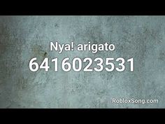 a business card with the words nyal arigato on it in white letters