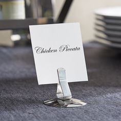 there is a place card holder on the table