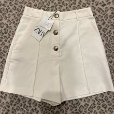 Nwt, Never Worn Cream Zara Shorts. Gold Tone 3 Buttons At Front. Size Small. Chic White Wide-leg Shorts, Chic Wide Leg Shorts For Day Out, Zara Spring Short Pants, Zara High-waisted Shorts For Day Out, Zara Shorts For Day Out, Zara Shorts For A Day Out, White Wide Leg Summer Shorts, Chic Zara High-waisted Shorts, Elegant Zara Shorts For Spring