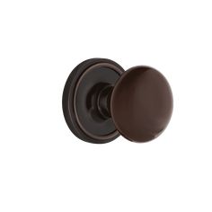 an antique style door knob with a dark brown finish on the front and side of it