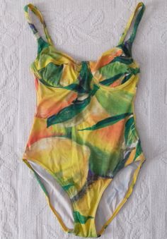 Vintage fruity and leafy pattern swimsuit. Flexible material in vivid summer colors. Before ordering the product, please read the product dimensions, as they may differ from the information on the label. Measurements taken from seam to seam while the garment is lying flat. Please, note that displayed on the monitor colors may vary from the actual, depending on individual monitor settings. PIT-PIT: 31 cm LENGTH without straps: 46 cm LENGTH with straps: 62 cm Multicolor Print Swimwear For Summer Pool, Summer Multicolor Swimwear For Pool, Summer Pool Multicolor Print Swimwear, Fitted Orange Tropical Print Swimwear, Green Tropical Printed Swimwear, Tropical Green Printed Swimwear, Vibrant Green Swimwear For Sunbathing, Beachwear Swimwear With Vibrant Green Print, Green Vibrant Print Swimwear For Beach Party