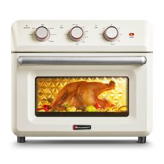 a chicken is cooking in an oven with the door open to show it's food