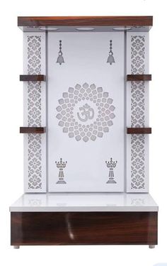 a white and brown shelf with an ornate design on it