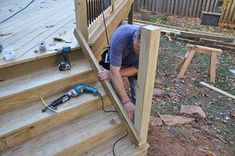 a man is working on the stairs outside