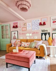 a living room filled with furniture and pictures on the wall