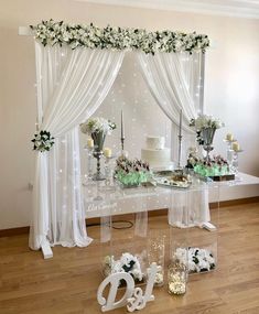 the table is decorated with flowers, candles and cake for an elegant wedding reception or special occasion