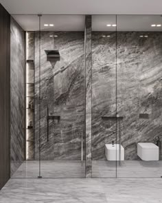 a modern bathroom with marble walls and floor