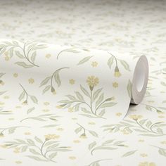 a roll of white paper with yellow flowers on it