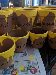 there are many cups that have chocolate on them with the words yummy written on them