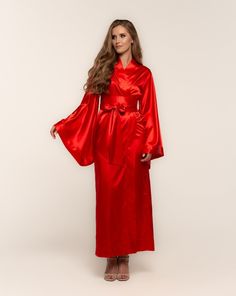 Irresistible in its classic kimono-cut design, this silky robe, seemingly tailored for women, is actually a versatile unisex garment suitable for both men and women alike. Featuring a satin finish, its dramatic sweeping hem and draped sleeves create a captivating silhouette. This piece, with its traditional tailoring and sophisticated essence, makes for an ideal gift, bringing luxury to every morning. ✓ garment length - 147 cm/58'' ✓ wrap over style ✓ two sets of inside ties ✓ wide obi-tie is in Fancy Robe, Robes For Men, Fancy Robes, Luxury Robes, Silky Robe, Maxi Kimono, Wrap Dresses, Drape Sleeves, Silk Robe