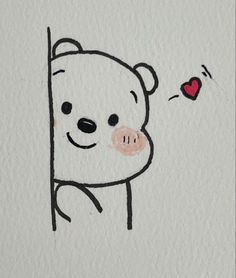 a drawing of a bear peeking out from behind a wall with a heart on it