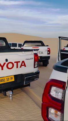 there are many toyota trucks in the desert