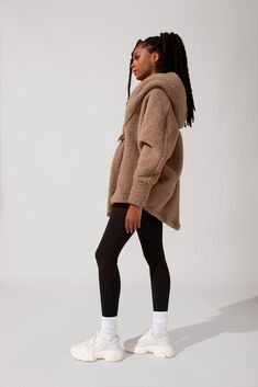 Strut to your morning workout class or down the aisles of Trader Joe’s with our most stylish, oversized Cocoon Coat. This romantic, just-above-the-knee length faux sherpa coat is bound to keep you warm and snug, all cozy-weather season. Our favorite feature: the thumb holes on the sleeves for warmth from head to fingertip. Comfy Oversized Winter Outerwear, Cozy Fleece-lined Outerwear For Loungewear, Cozy Fleece-lined Loungewear Outerwear, Cozy Snug Outerwear For Loungewear, Snug Cozy Loungewear Outerwear, Sporty Winter Outerwear For Loungewear, Cozy Winter Outerwear For Daywear, Oversized Comfy Fall Outerwear, Cozy Outerwear For Loungewear