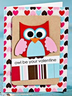 an owl is sitting on top of a valentine's card with hearts around it