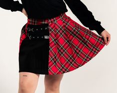 (Model is wearing a size Medium) Size Waist Hips Length Small 25” 35” 15” Medium 27” 37” 16” Large 29” 38” 16” XL 31” 39” 16” XXL 33” 40” 17” Punk Fitted Skirt For School, Punk Style Fitted Skirt For School, Edgy Fitted Skirt For School, Fitted Alternative Pleated Skirt, Fitted Mini Skirt For Spring In Alternative Style, Fitted Alternative Style Mini Skirt For Spring, Red Fitted Alternative Style Skirt, Fitted Winter School Bottoms, Black Winter Skort For School