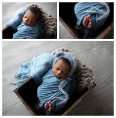 a newborn baby wrapped in a blue blanket is laying on top of a wooden box