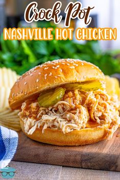 the crock pot nashville chicken sandwich is on a cutting board