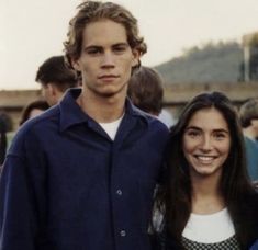 a man and woman standing next to each other