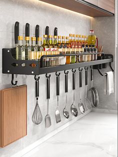 a rack with utensils hanging from it's side in front of a counter