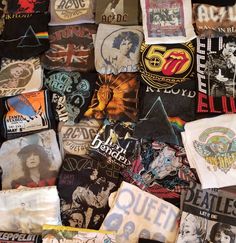 many different t - shirts are stacked together on top of each other