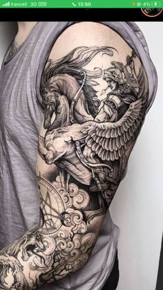 a man with a tattoo on his back and shoulder is shown in the image, it looks