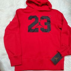 New With Tags Jordan Red Hoodie Size Medium = 10/12 Years Size Small = 8/10 Years Red Hooded Fleece Top, Red Sports Hoodie With Adjustable Hood, Red Fleece Sweatshirt With Adjustable Hood, Red Sporty Sweatshirt With Adjustable Hood, Sporty Red Sweatshirt With Adjustable Hood, Sporty Red Winter Hoodie, Red Long Sleeve Top With Adjustable Hood, Red Long Sleeve Tops With Adjustable Hood, Red Sports Hoodie Top