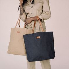 Designed to take you everywhere, meet the must-have, double-handled tote bag that you'll reach for season after season. With a generously spacious interior, this bag is your go-to for work, play, kids and travel and will keep you looking chic and put together. Lightweight and sustainably made, you won't want to leave home without it. Everyday Weekender Bag With Double Reinforced Handles, Trendy Double Handle Canvas Bag For Travel, Everyday Canvas Travel Bag With Top Handle, Everyday Canvas Travel Bag With Top Carry Handle, Beige Travel Bag With Handles For Everyday Use, Daily Use Canvas Bag With Double Handle, Beige Travel Bag For Everyday Use, Versatile Travel Bags With Handles, Everyday Large Capacity Bags With Double Handle