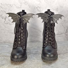 These are 3D printed bat shoe wings that attach to your shoes via the shoelaces. These will look great on your black boots!  Dimensions: One wing measures: 3.5" long x 2.5" wide x 3mm deep *Great for dracula/vampire Halloween costumes/cosplay *Witch Halloween costumes/cosplay *Just for fun *You could even add them to the strings of a cape. Check out our other Halloween/Cosplay items here --> https://www.etsy.com/shop/3DPrinceLLC?ref=seller-platform-mcnav&section_id=30872225 Check out our entire Bat Witch Costume, Bat Wing Clothes, Gothic Lace-up Boots For Halloween, Vampire Boots, Bat Corset, Vampire Bat Costume, Wings For Shoes, Bat Cosplay, Evil Sorceress