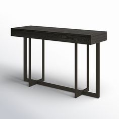 a wooden table with metal legs and a black finish on the top, against a white background